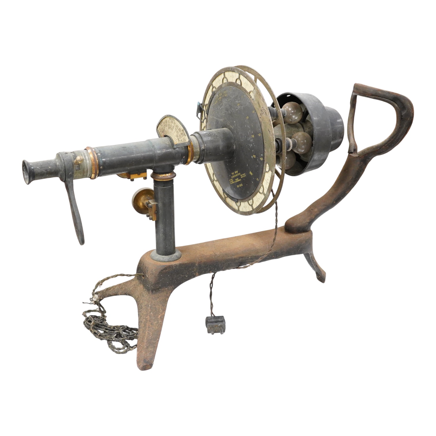 An early 20th century ophthalmic keratometer, designed to allow opticians to establish the curvature of a patient’s eye, constructed of cast-iron, brass and tin, and fitted with electric lamps and early celluloid scales,